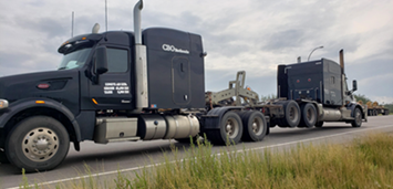 truck towing another truck